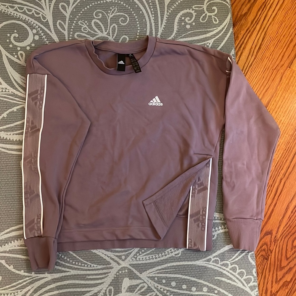 Womens adidas shirt with adidas patches on arms and shirt